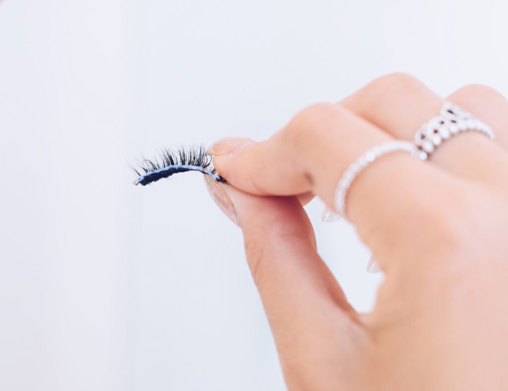 Closeup of a fake eyelash with a glue on