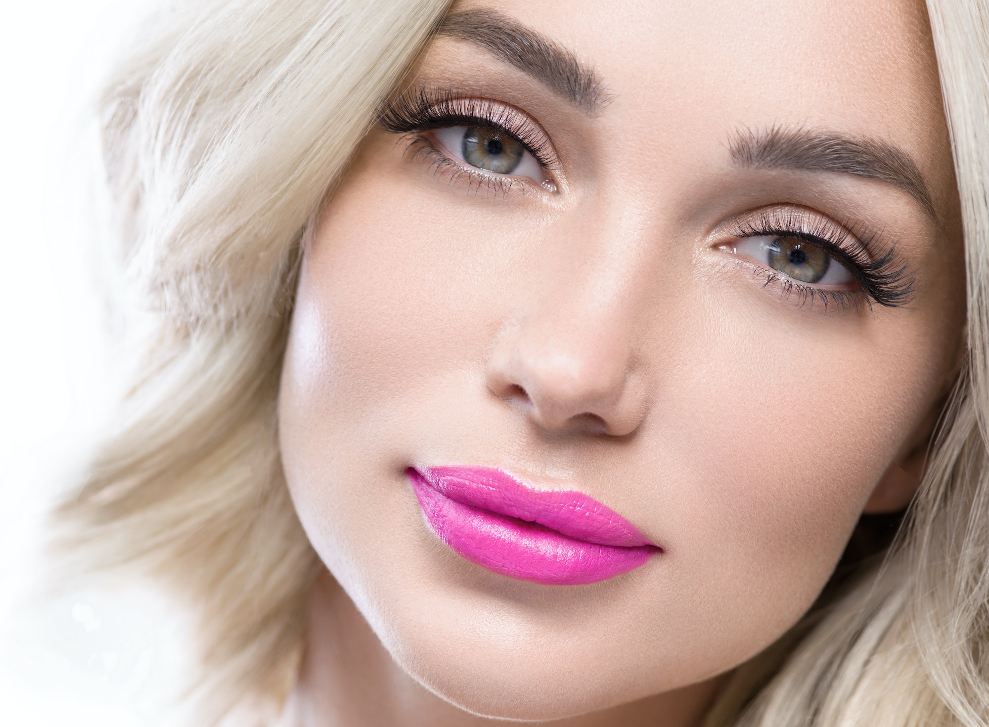 Beautiful lashes long blonde hair woman pink lipstick